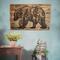 This is a large wood wall hanging featuring a bear and a forest scene. The artwork is wood burned by hand onto a pallet of reclaimed fence. 